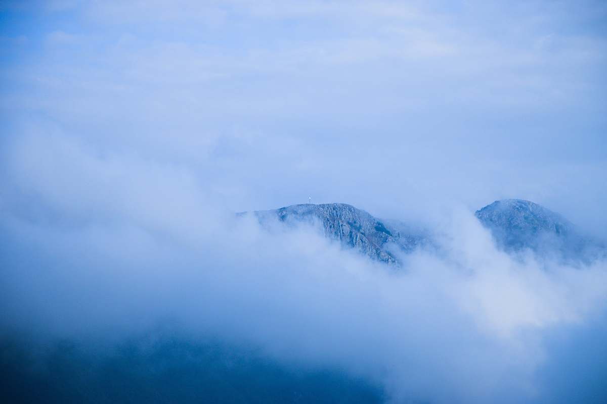 mountain mountain covered with fog cloud