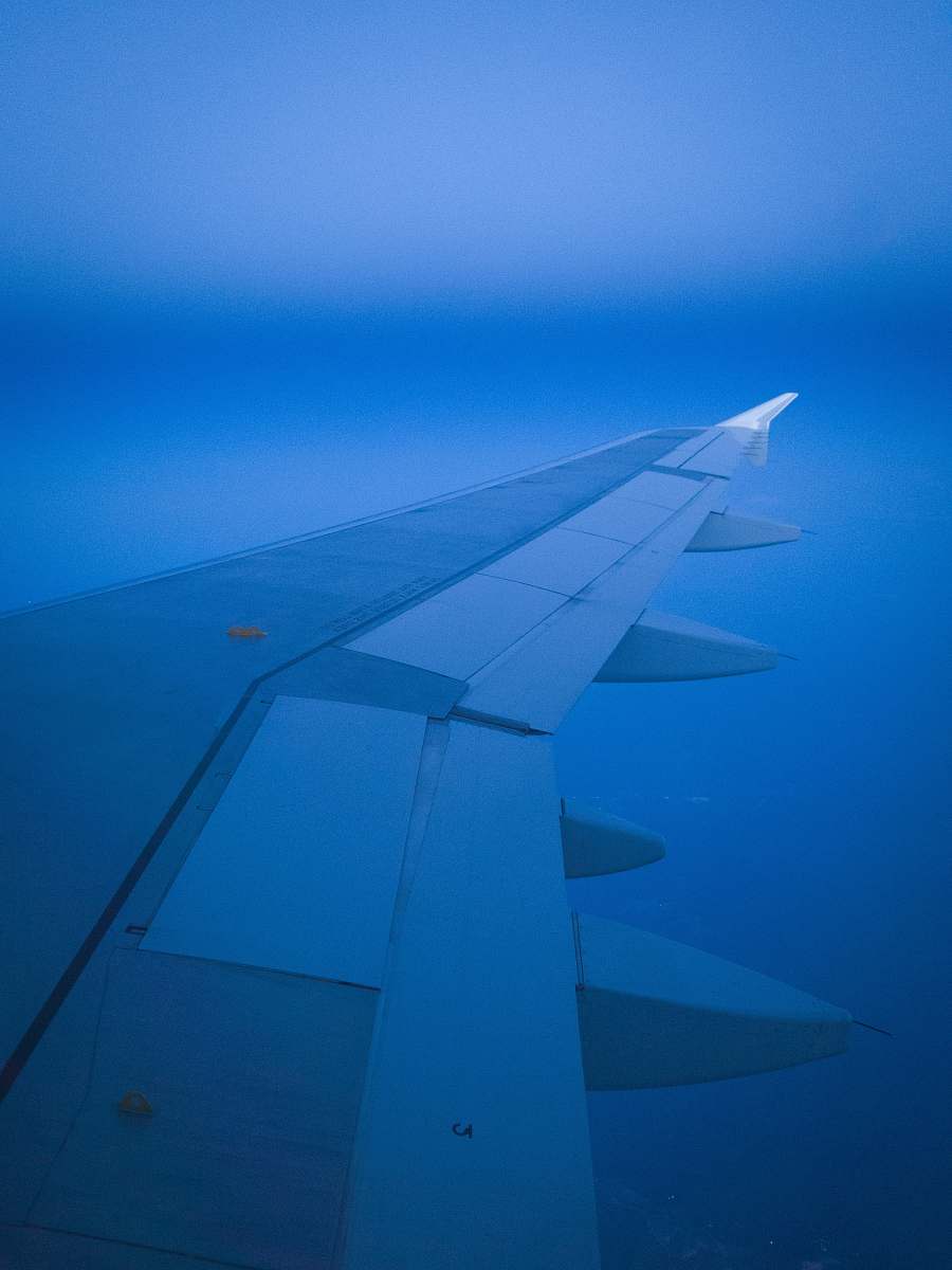 engine panel wing on clouds bradley international airport