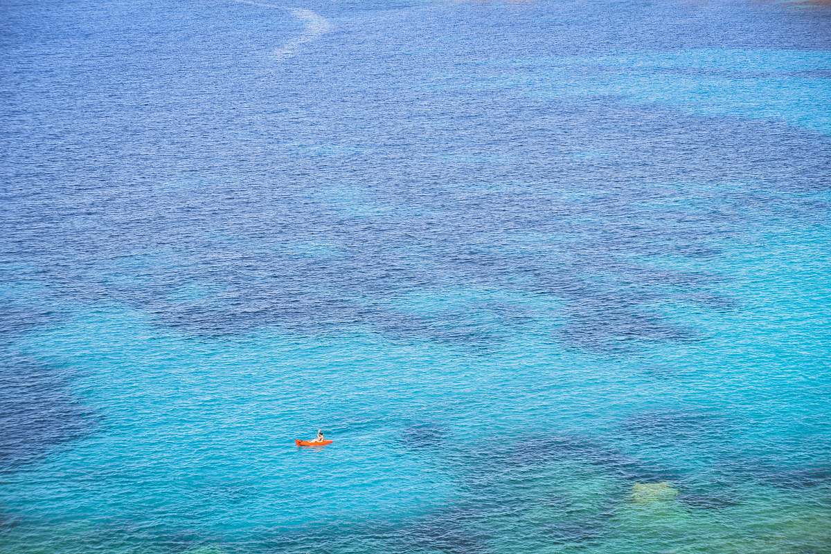 nature person riding on boat during daytime ocean