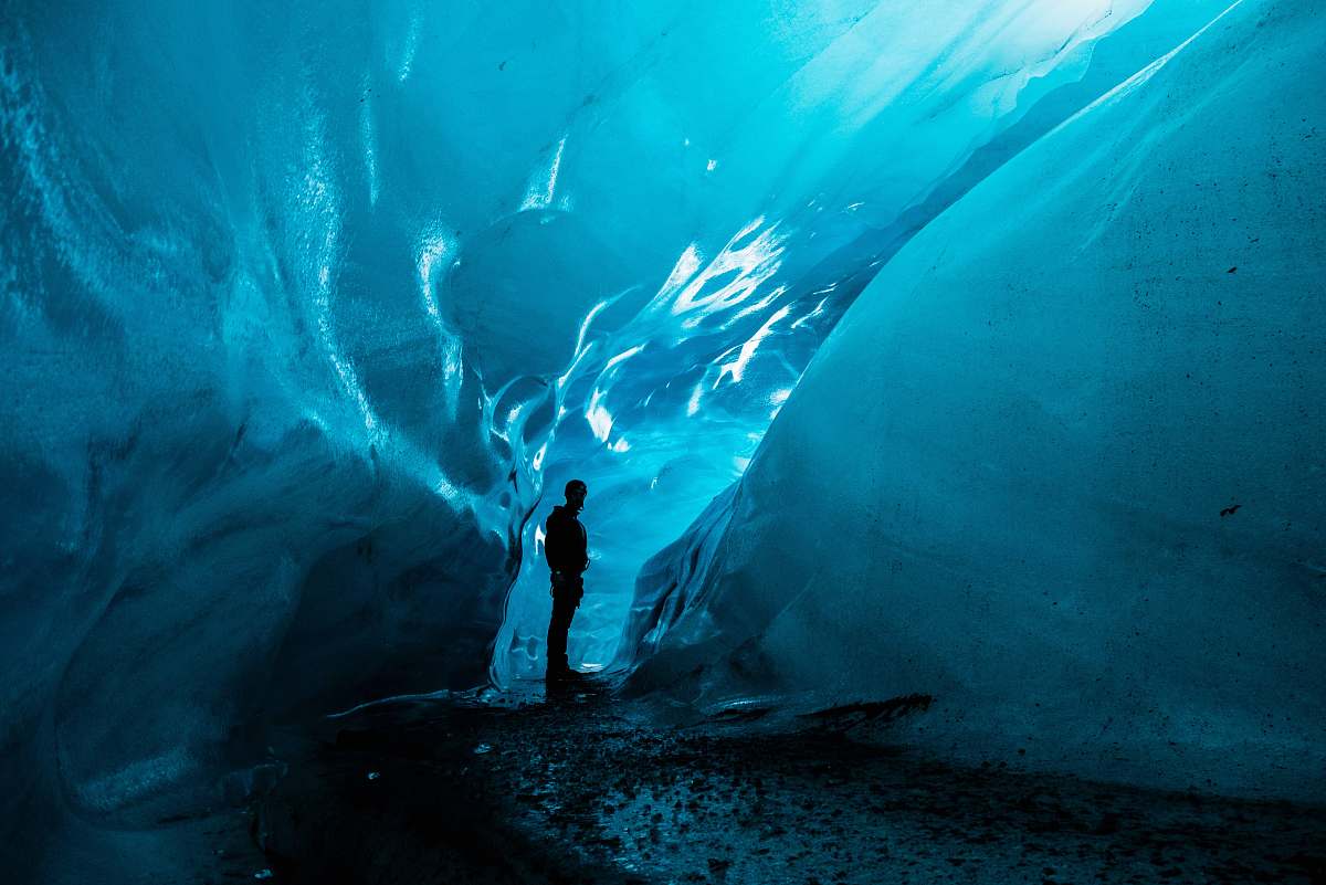 nature person standing in ice cave at daytime iceland
