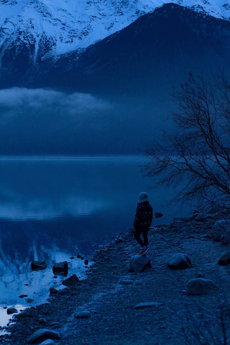 nature person standing nearby body of water person