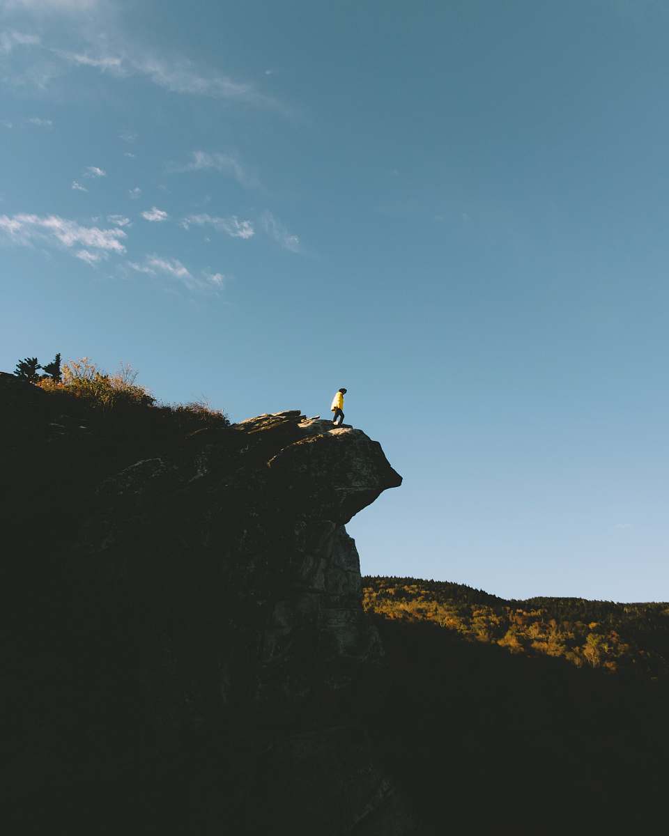 cliff person standing on cliff point boone