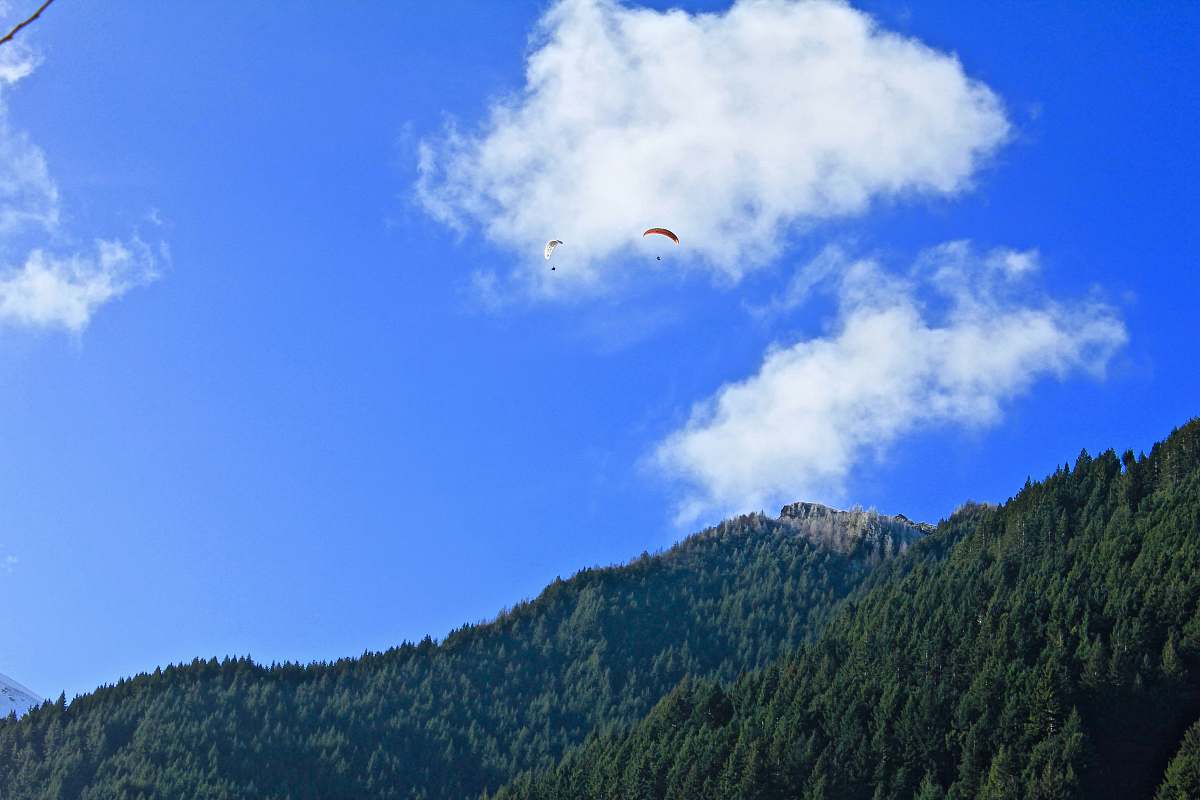 cloud person using parachute landscape