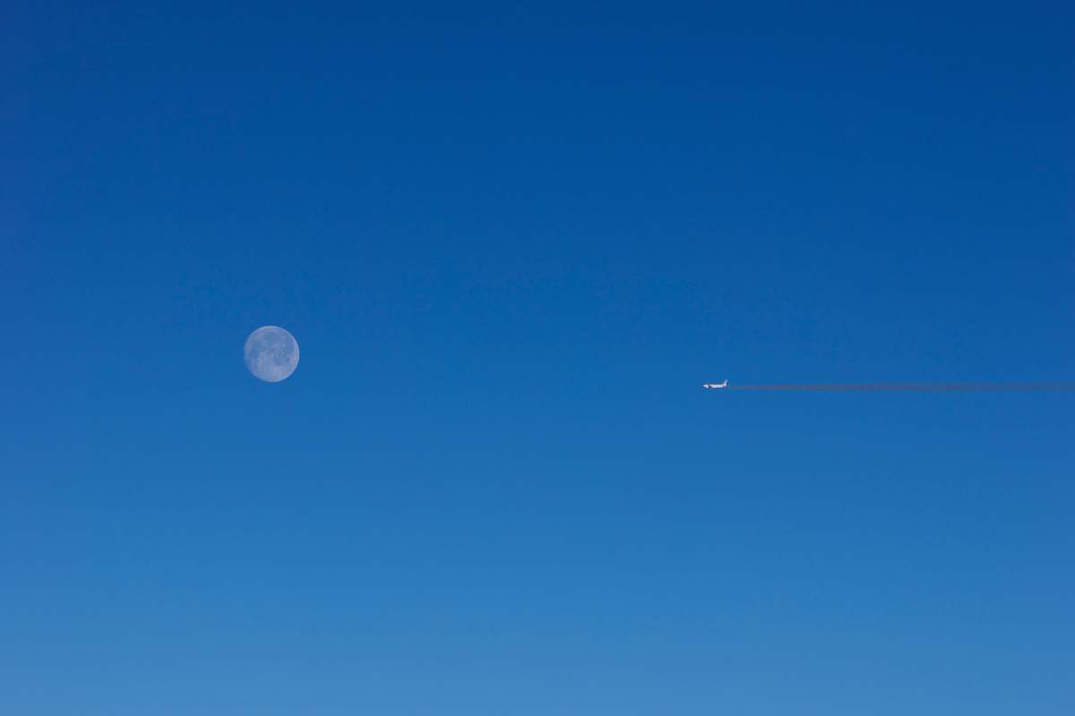 nature plane at flight overlooking full moon outdoors