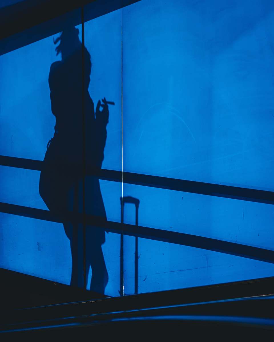 amsterdam shadow of person holding cigarette stick during nighttime netherlands