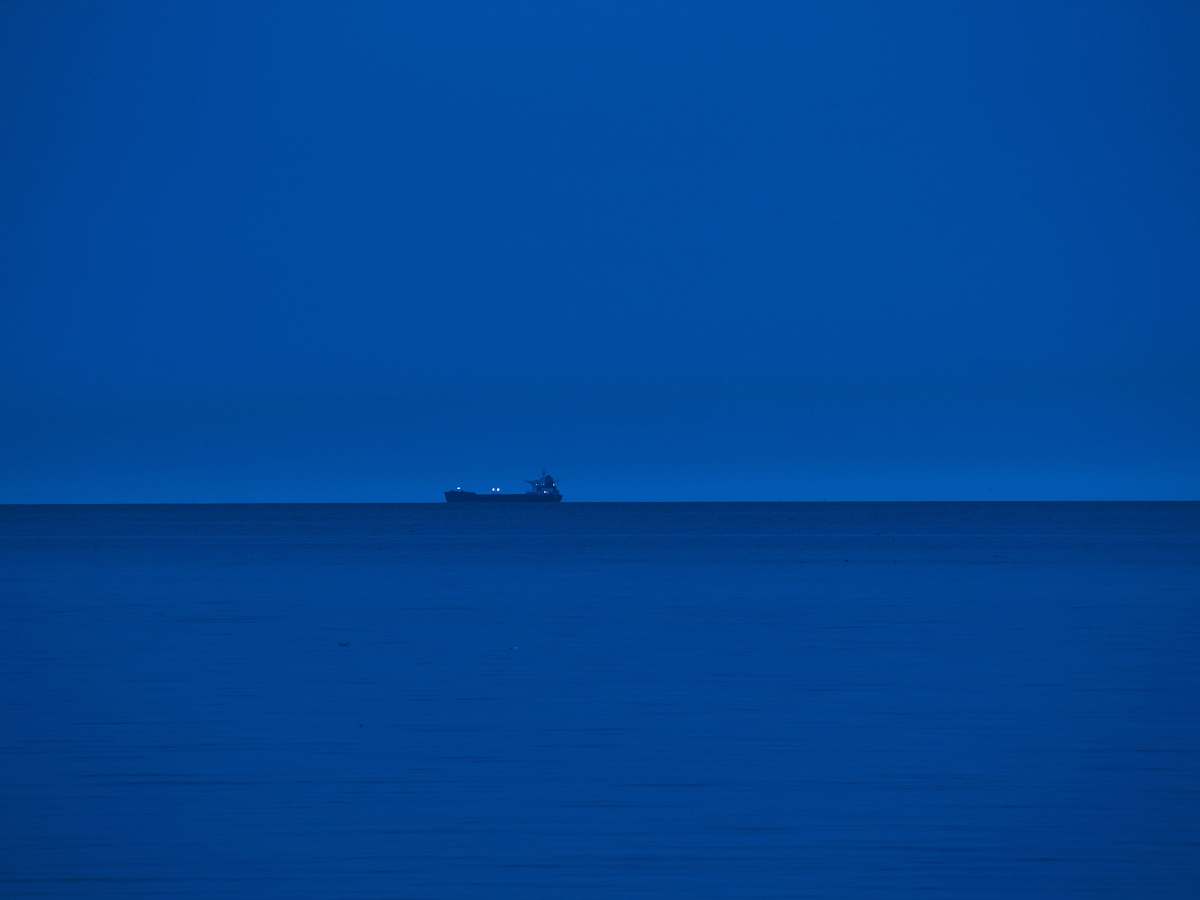 nature ship sailing on the blue sea teal
