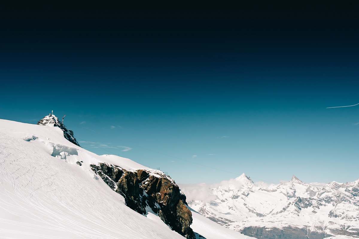 mountain snow covered rock under blue sky snow