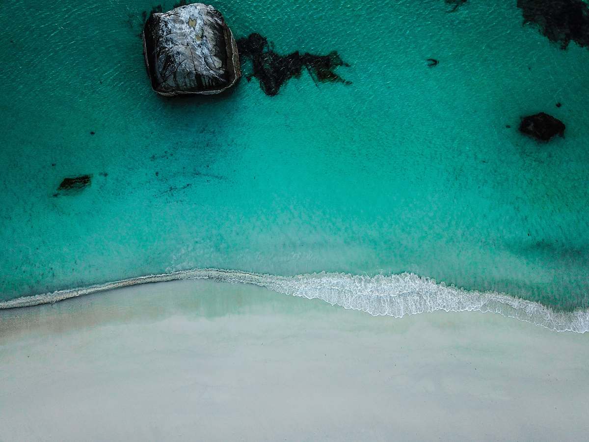norway teal and black blanket haukland beach