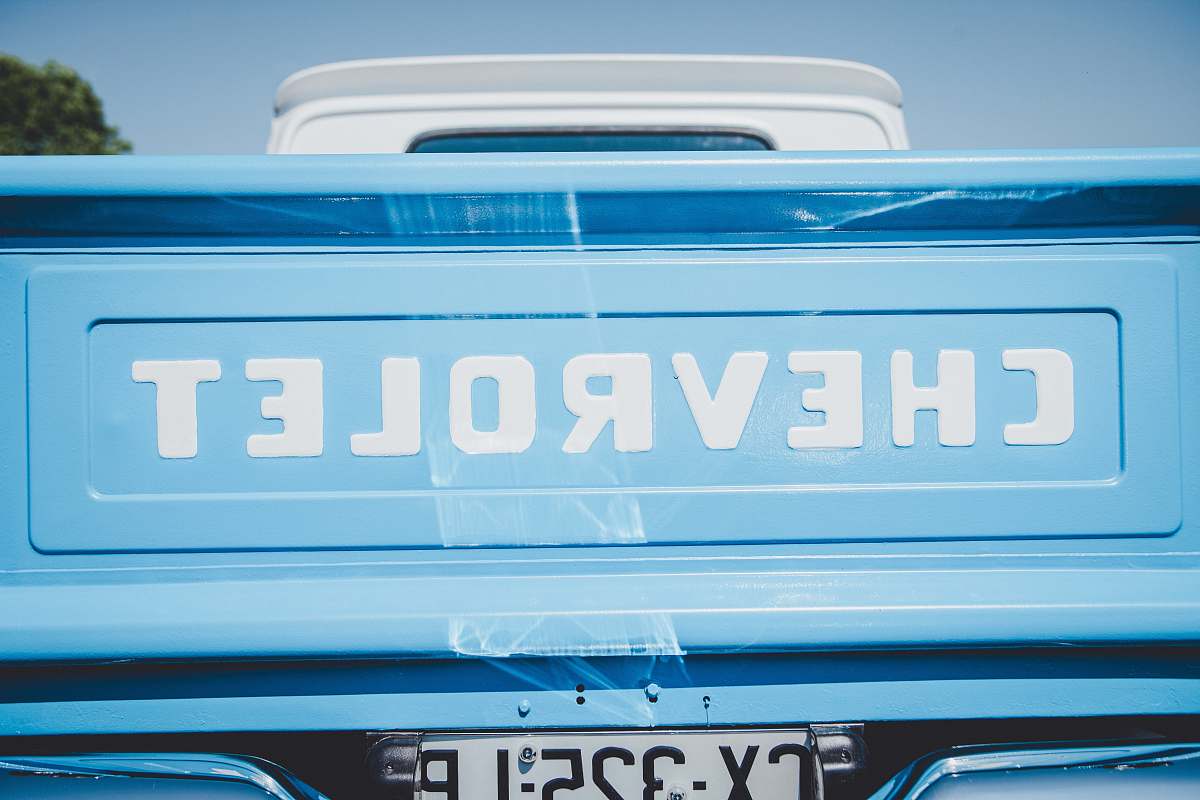 bavans teal Chevrolet pickup truck's tailgate closeup photo france
