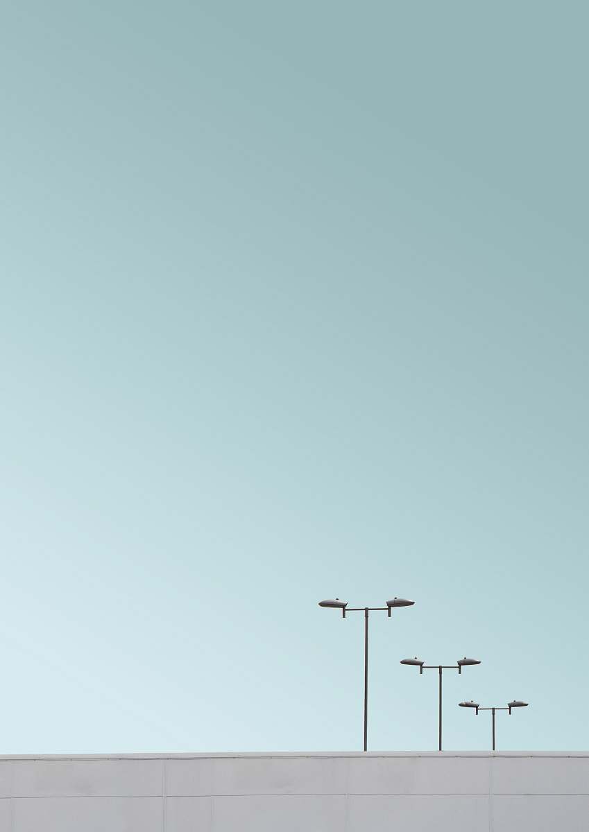 slough three light posts under clear skies united kingdom