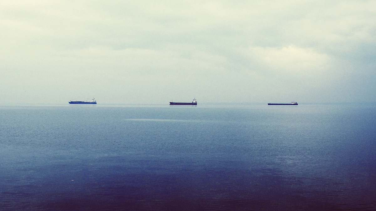water three ship on calm body of water ships