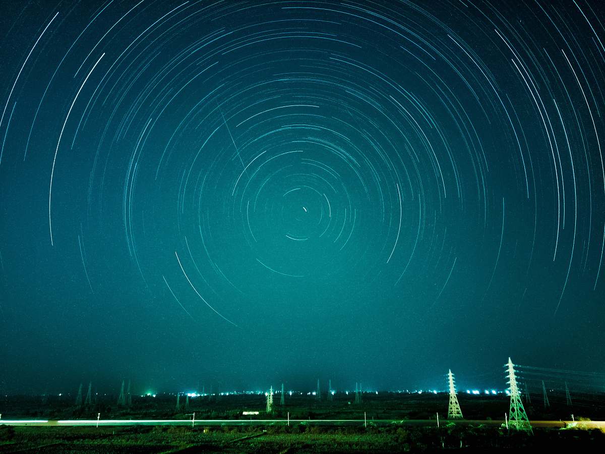 teal time-lapse photograph of stars night