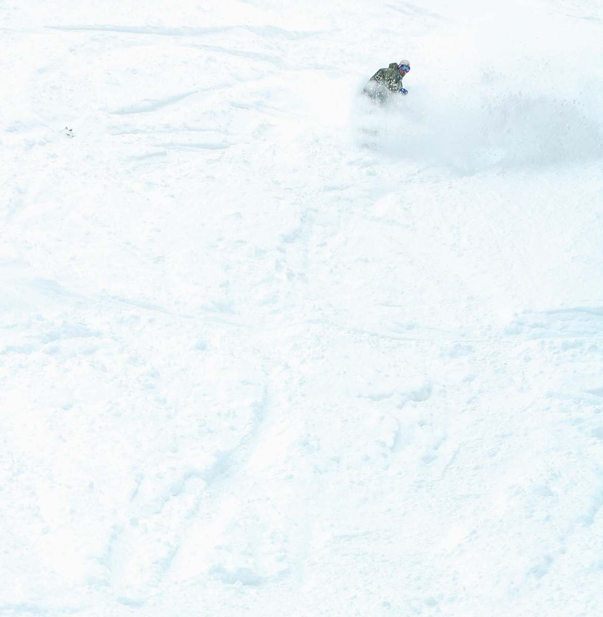 nature time lapse photography of man skiing in the snow outdoors