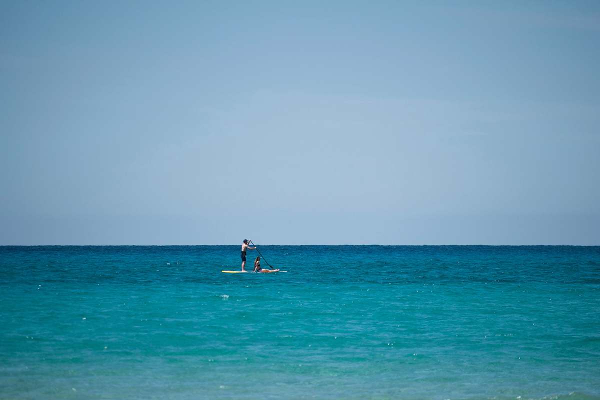 transportation topless man riding paddle board vehicle