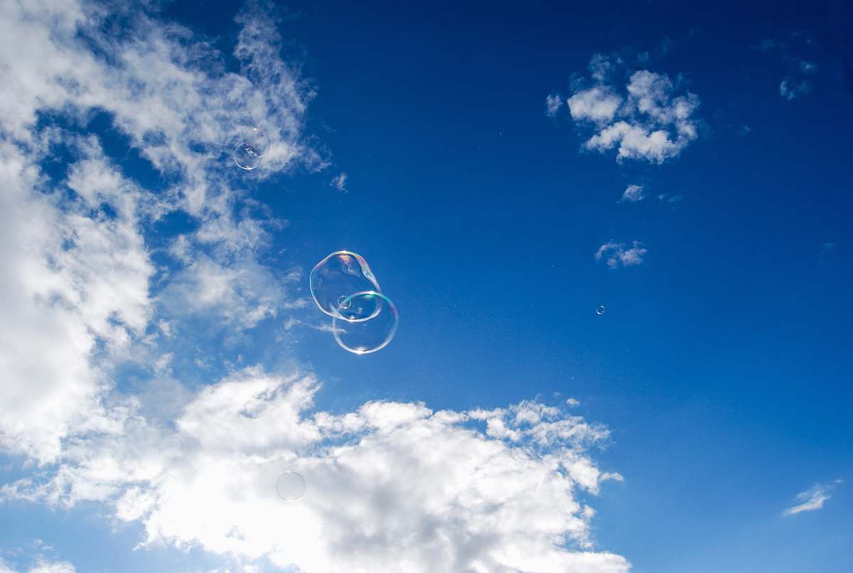 nature two bubbles under blue sky and white clouds during daytime sky