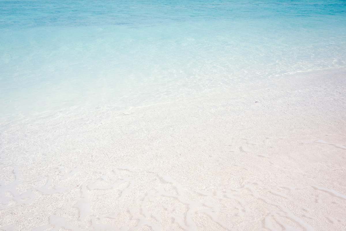sea wave of water on sea shore sand