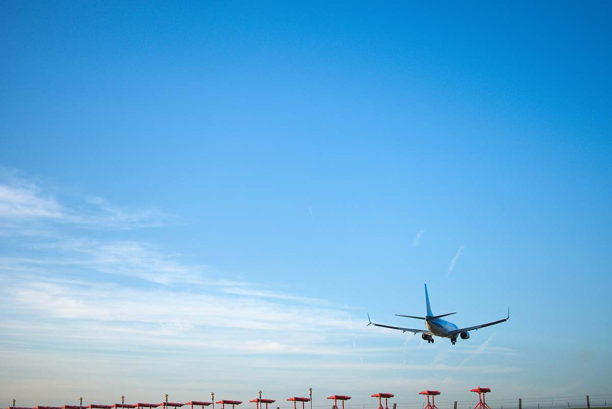 airplane white airplane flying during daytime transportation