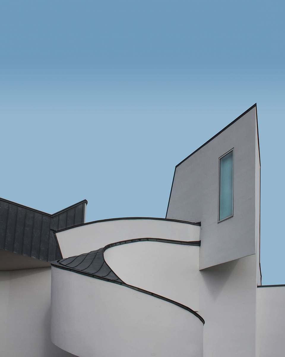 banister white and black concrete building during daytime handrail