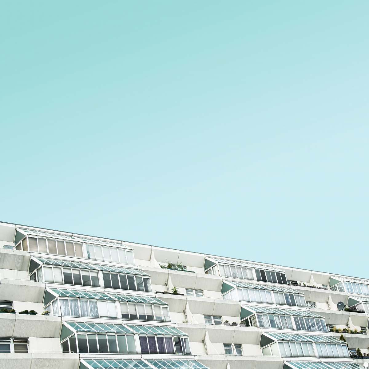balcony white and brown concrete building at daytime london