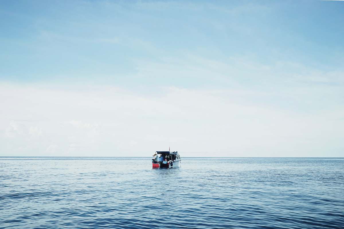 boat white and orange pontoon boat water