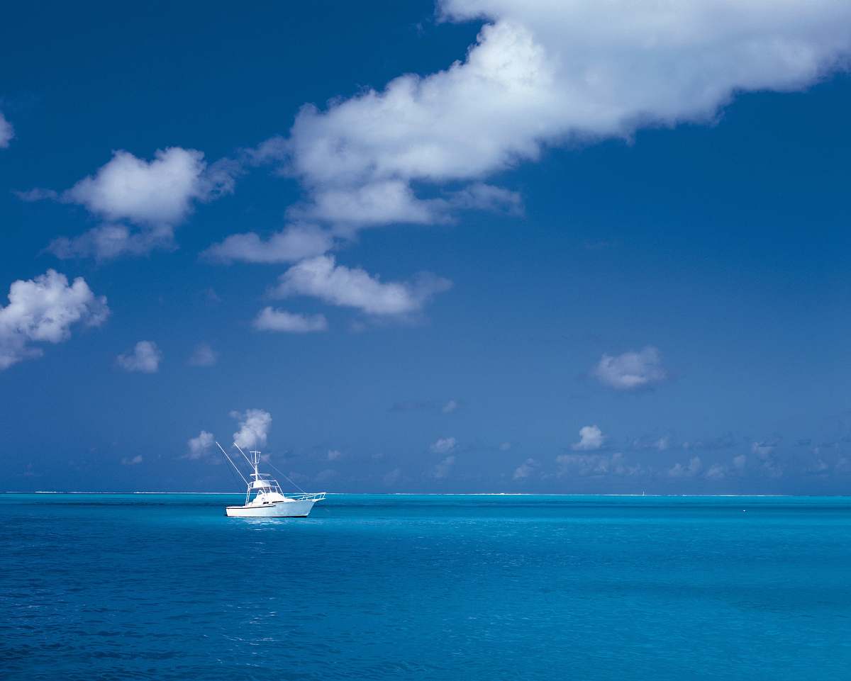 ocean white boat on sea under cloudy sky sea