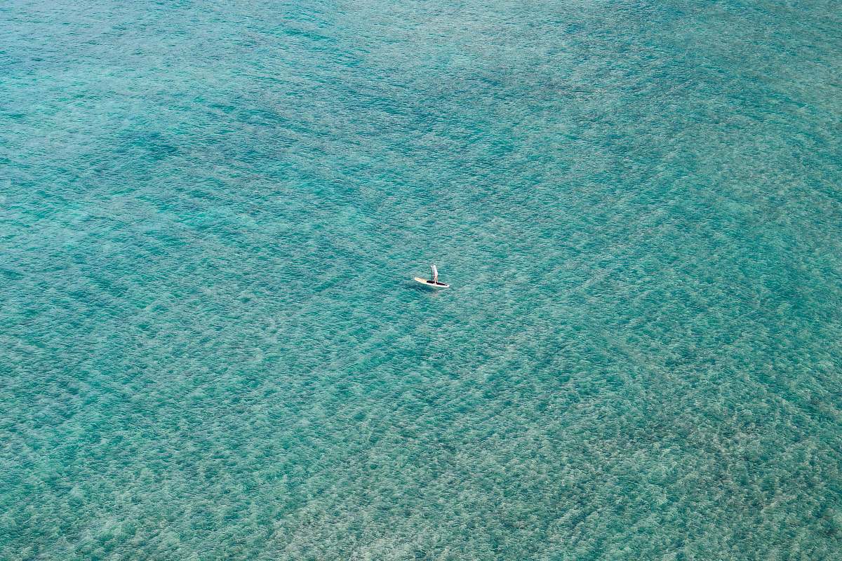 teal white boat sailing on body of water oahu