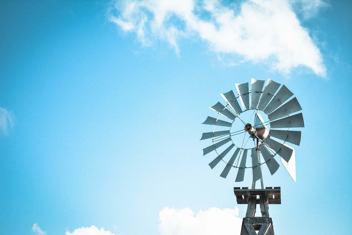 turbine windmill under blue and white cloudy skies at daytime cloud