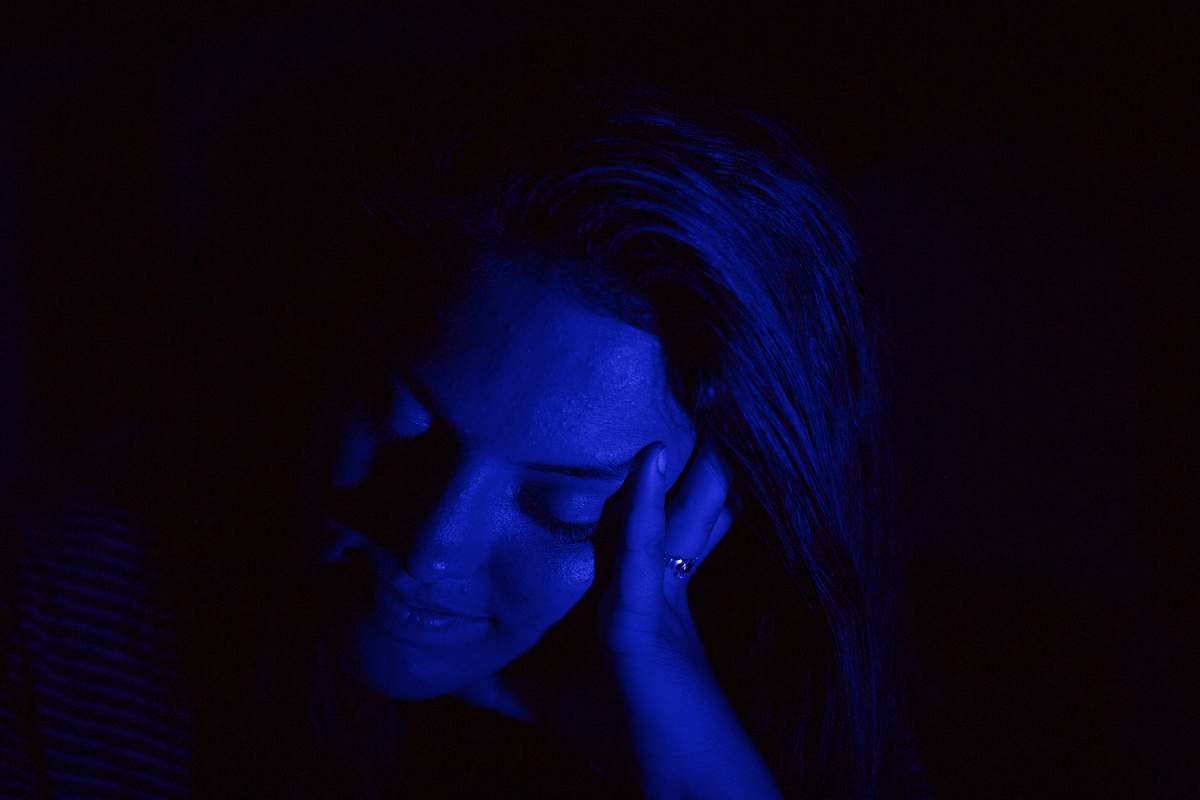 human woman holding her head person