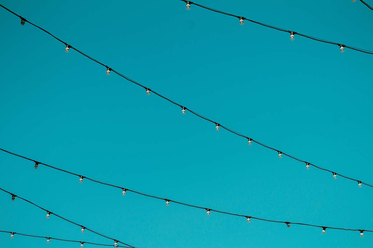 background worm's eye view photography of black string lights lights