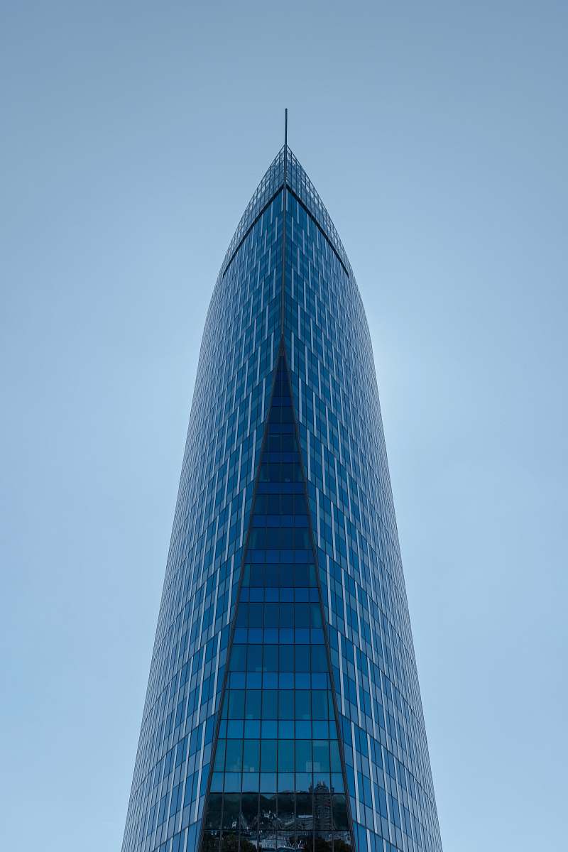 city blue glass building high rise