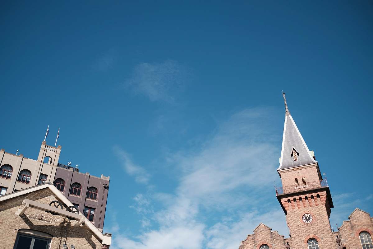 architecture brown castle under blue and white skies tower