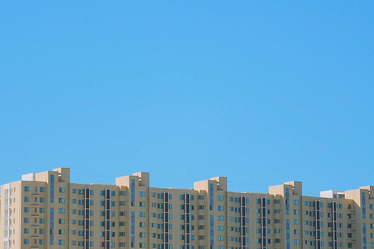 city gray concrete building during daytime high rise