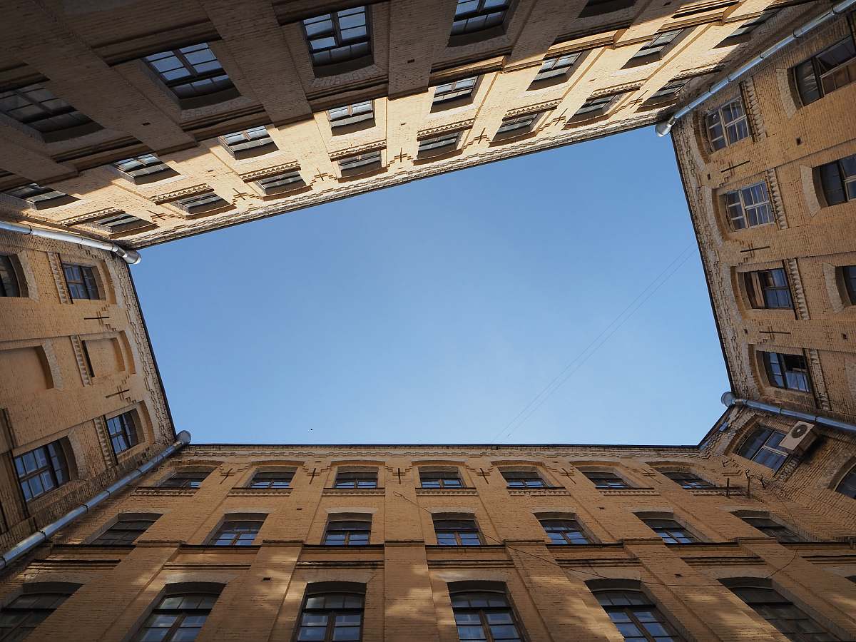 architecture low angle photography of building under clear sky window