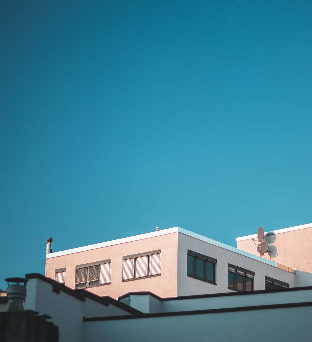 blue white concrete house during daytime architecture