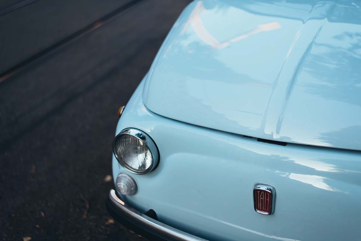 automobile white FIAT car parked on asphalt road vehicle