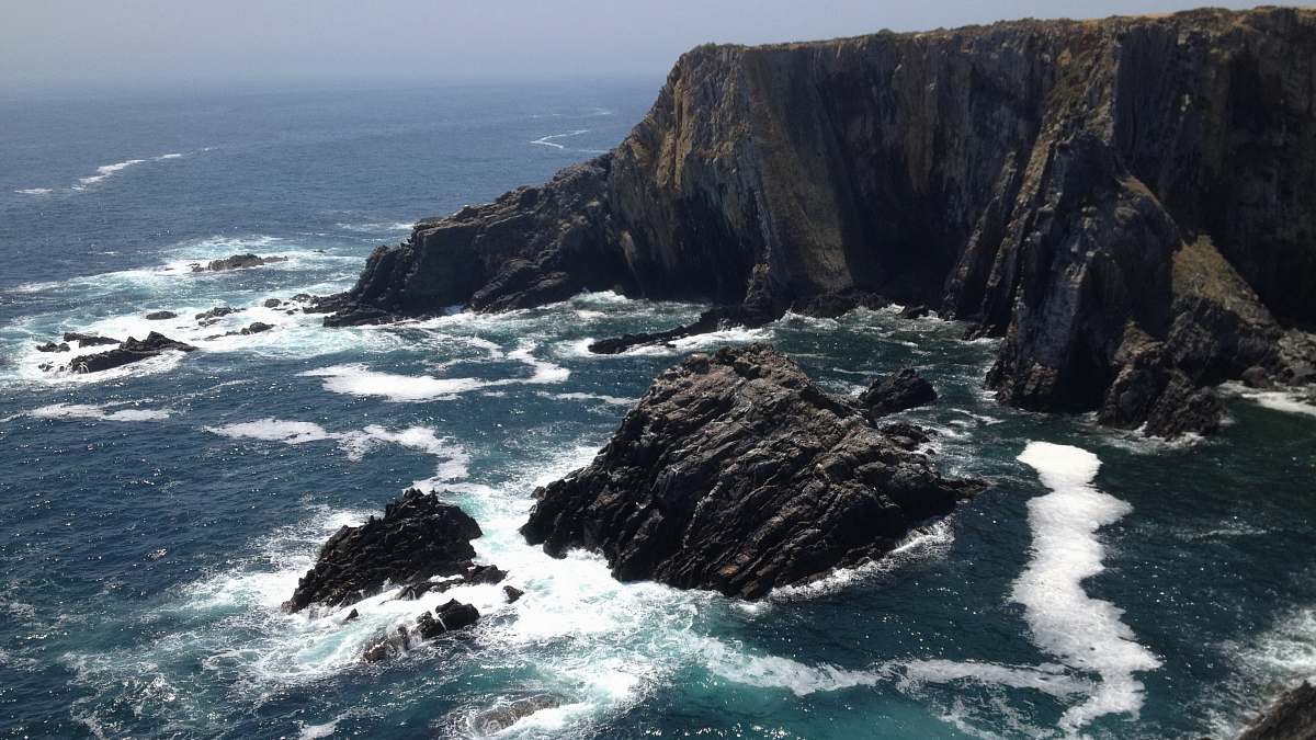 waves rock formations in body of water rocks