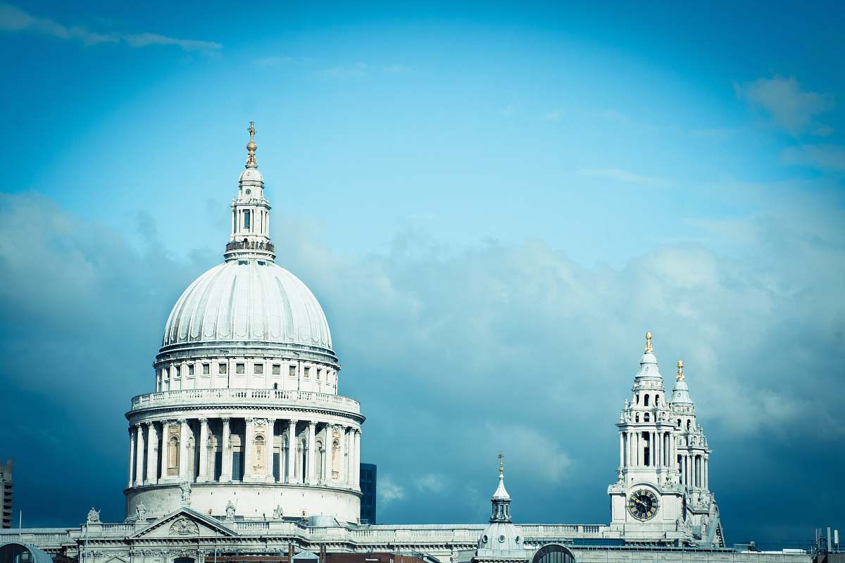 cathedral gray concrete building with black wall clock church