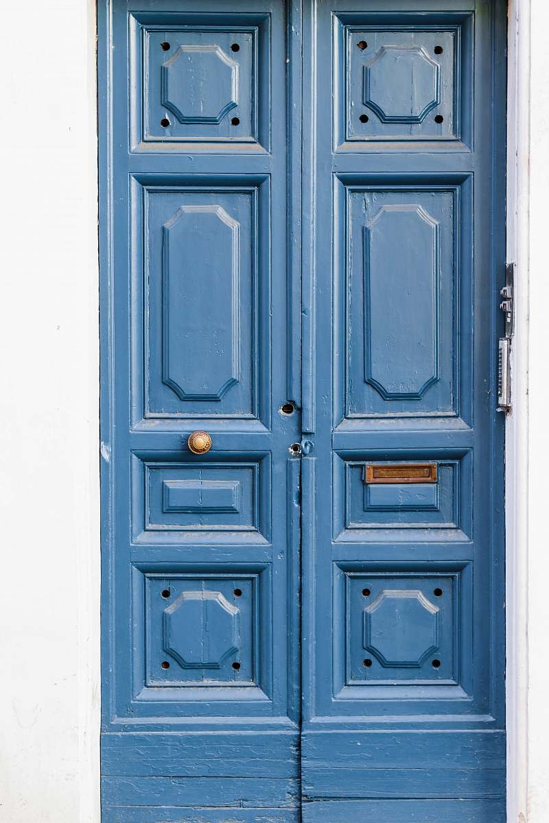blue brown wooden paneled doors rome