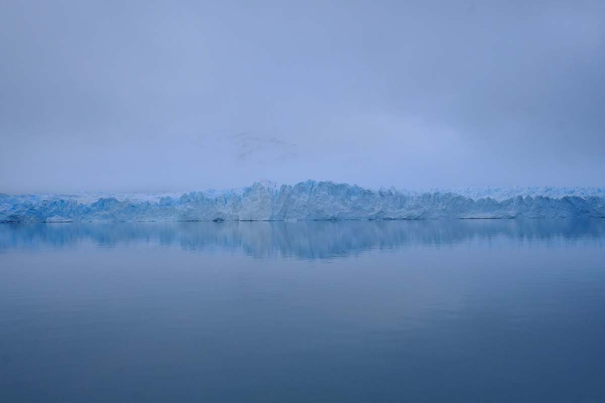 glacier photography of sea near mountain covered with snow cold