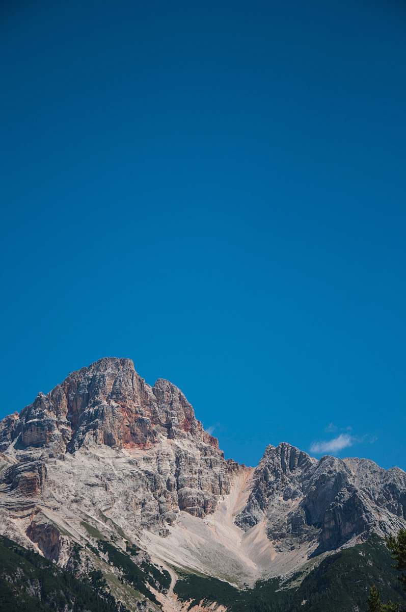 blue brown rock mountains photo during daytime crest