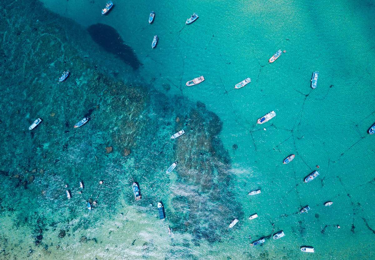 outdoors aerial photography of boats sailing on sea at daytime water