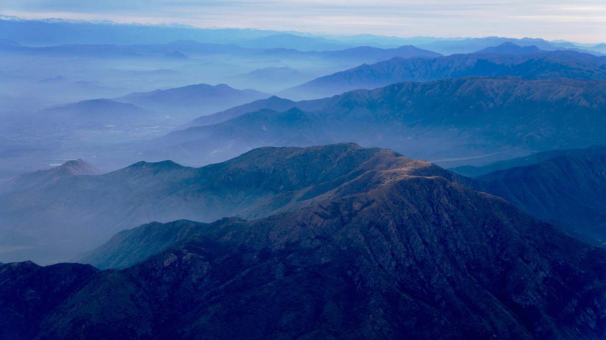 blue aerial photography of mountain range mountain