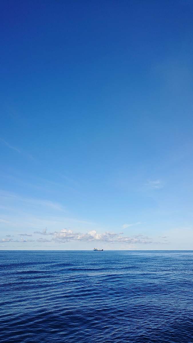 outdoors calm body of water azure sky