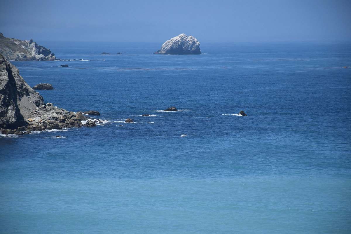 outdoors gray rock on body of water land