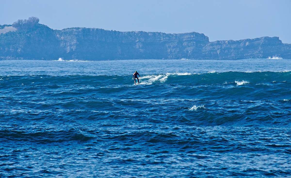 ocean man surfing at the ocean during day sea