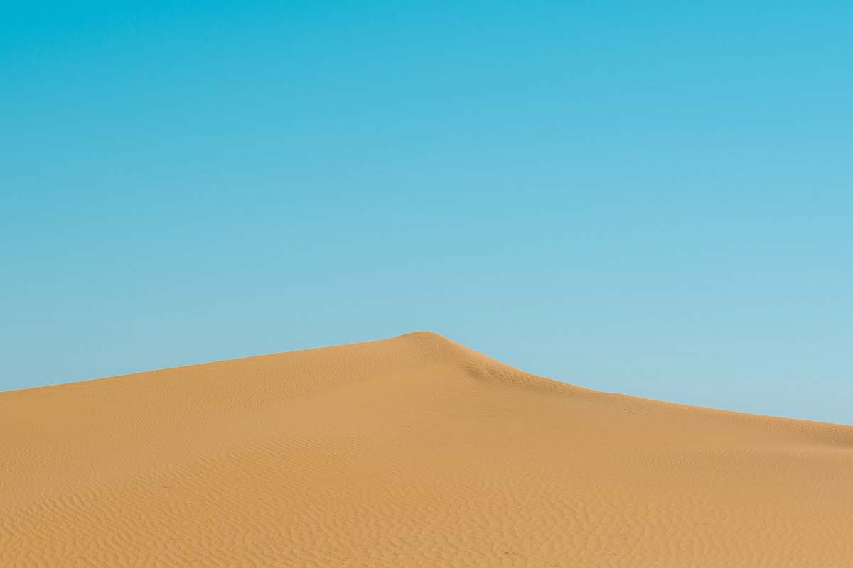 outdoors photo of brown sand dunes soil