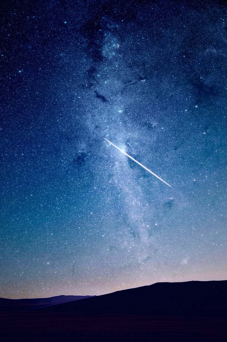 space shooting star under blue sky stars