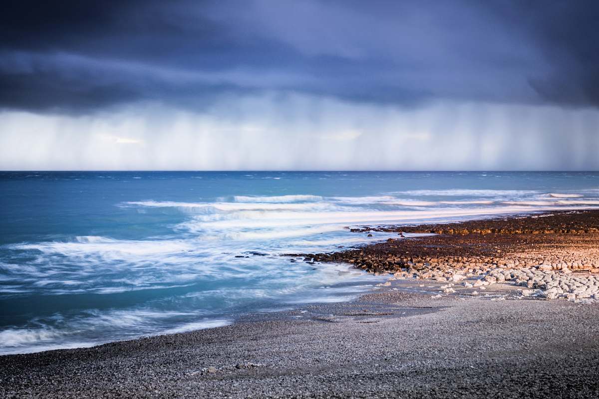 waves landscape photography of seashore rain