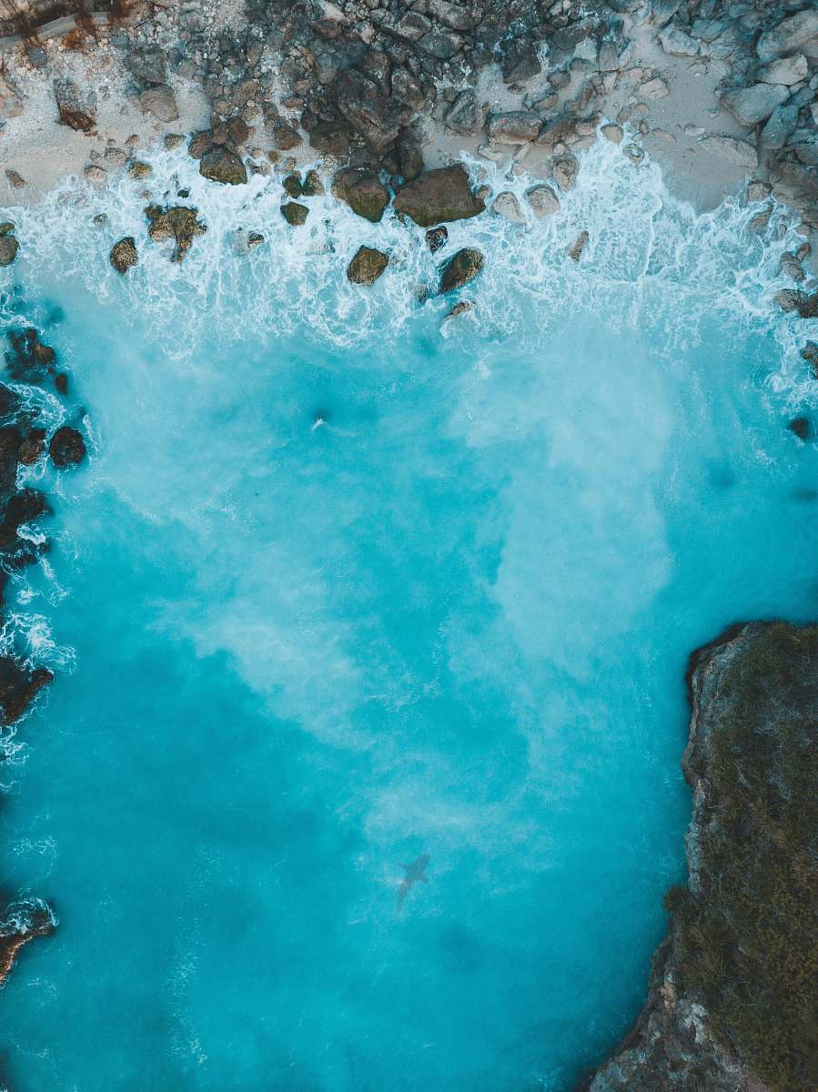 blue aerial photo of body of water water