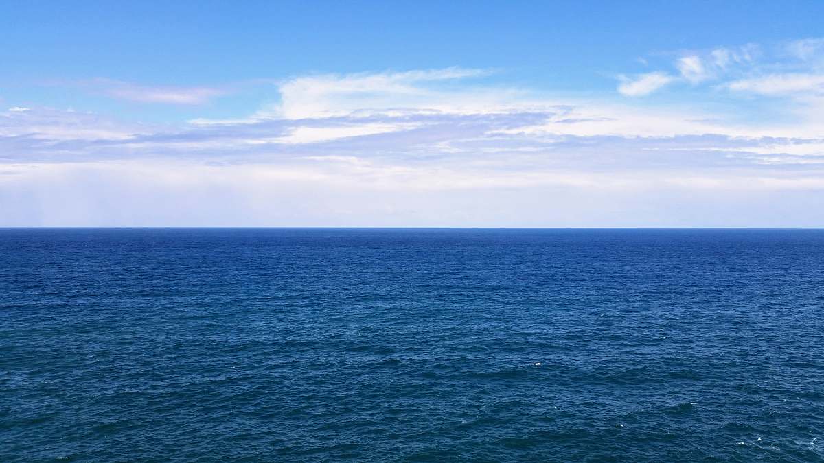nature blue sea under blue sky and white clouds sky